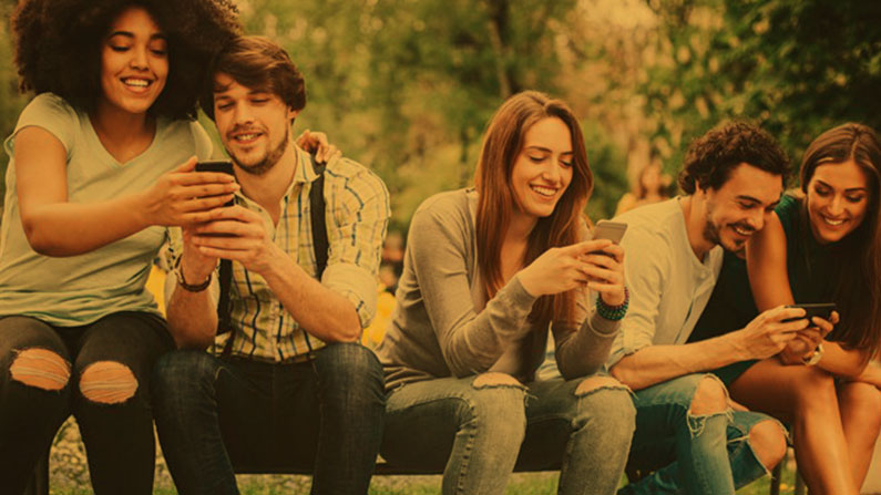 Group of teenagers on their phones
