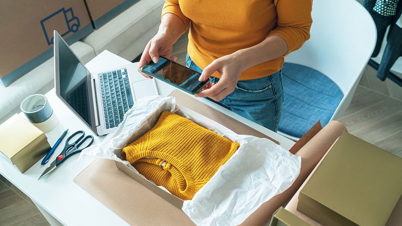 Woman taking a picture of merchandise