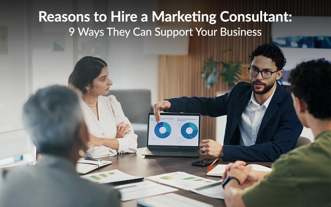 A marketing consultant sitting with a business owner at a desk, discussing a marketing plan